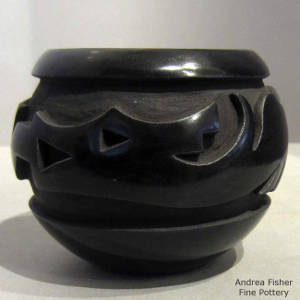 Avanyu design carved into a black jar