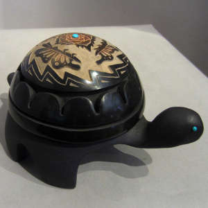 Sgraffito designs and inlaid turquoise on a blackware turtle