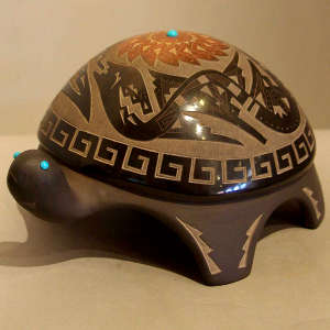 Sgraffito avanyu and geometric design on a carved black turtle with inlaid turquoise