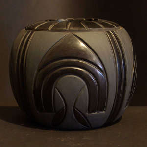Carved geometric design on a black on black jar