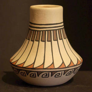 Feather and geometric design on a low-shouldered polychrome jar