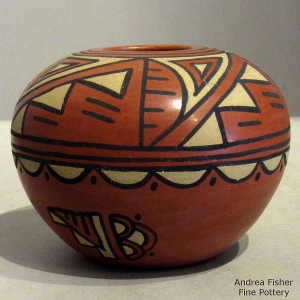 Kiva step, cloud and geometric design on a polychrome seed pot
