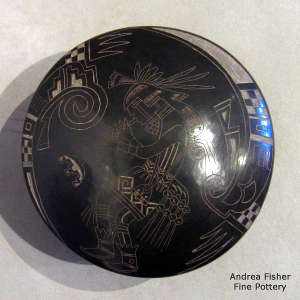 Sgraffito kokopelli and geometric design on a black seed pot