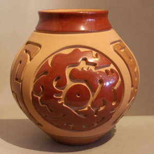 Geometric design carved into a polychrome jar