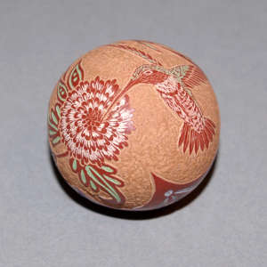 Sgraffito hummingbird, flower and geometric design on a polychrome seed pot