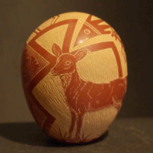 Sgraffito deer and geometric design on a red seed pot