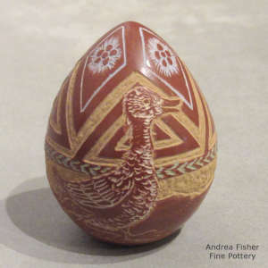 Sgraffito duck and geometric design on a miniature polychrome red seed pot