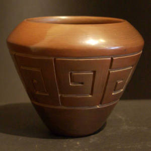 Brown jar carved with geometric designs