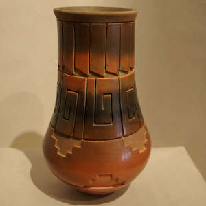 Geometric designs carved into a brown jar