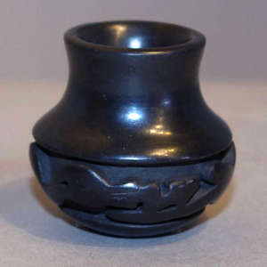 Avanyu design carved into a miniature black jar