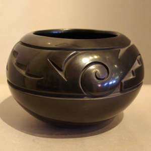 Geometric design carved into a black jar