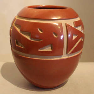 Geometric design carved into a red jar