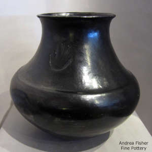 Bear paw imprint on a polished black jar