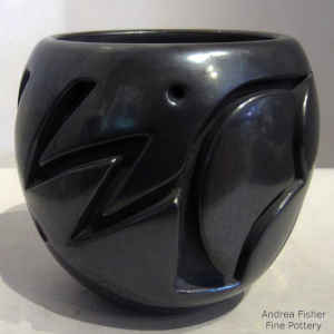 Black jar carved with a geometric design