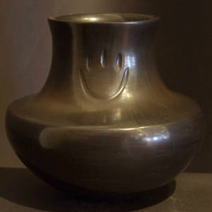 Bear paw imprint on a polished black jar