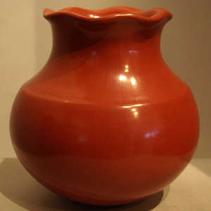 Fluted rim on a polished red jar