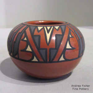 A kiva step, feather and geometric design on a polychrome jar