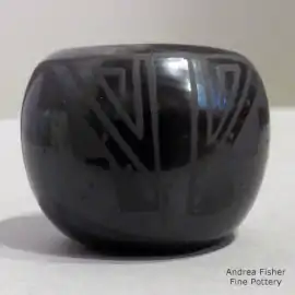 Geometricv design on a black-on-black miniature pot