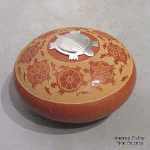 Red seed pot with a sgraffito turtle, fish and geometric design plus a Sterling silver Shifting Sands design turtle-shaped lid