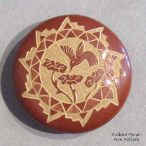 Miniature red seed pot with a sgraffito hummingbird, flower and geometric design