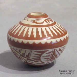 Kiva step, avanyu and geometric design on a miniature red and white seed pot