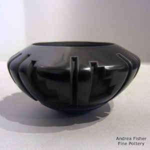 A kiva step geometric design carved into a black bowl