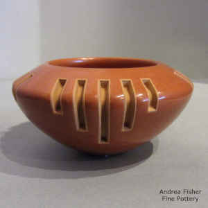 4-direction geometric design carved into a red bowl