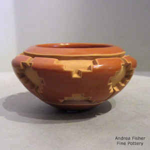 4-panel stylized butterfly design carved into a red bowl