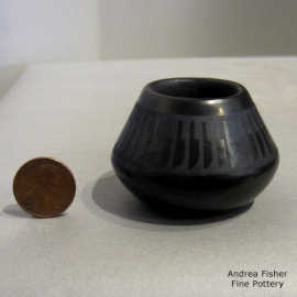 Band of feathers design on a miniature black-on-black jar