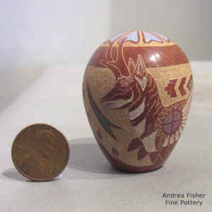 Sgraffito and painted antelope, yucca, feather and geometric design on a miniature polychrome seed pot