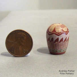 Sgraffito and painted peregrine falcon, feather and geometric design on a miniature polychrome seed pot