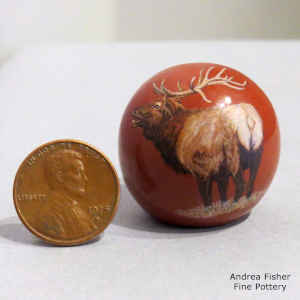 Sgraffito and painted elk, fish and butterfly design on a miniature polychrome seed pot