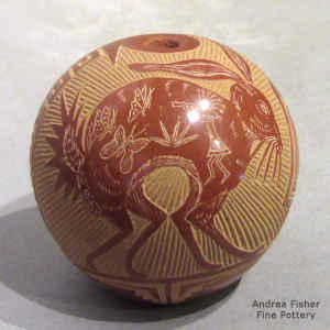 Sgraffito Mimbres-style rabbit, butterfly, kokopelli and geometric design on a miniature red seed pot