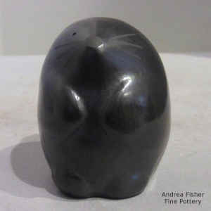 Geometric design on a black rabbit figure