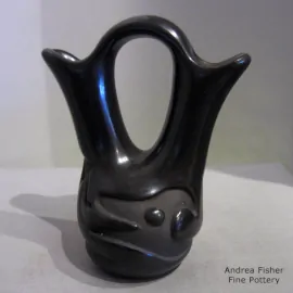 Black wedding vase carved with an avanyu design