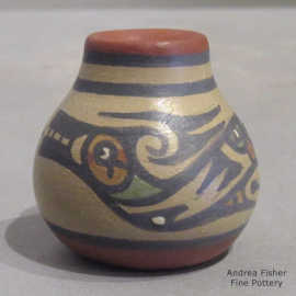 Miniature polychrome jar decorated with an avanyu design