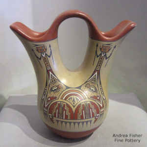 Yei, insect and geometric design on a polychrome wedding vase
