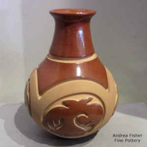 Polychrome jar carved with a medallion and geometric design