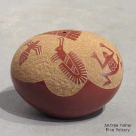 Sgraffito wildlife and geometric design on a miniature red seed pot