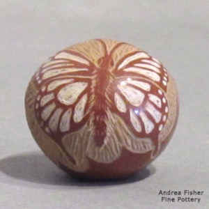 Sgraffito and painted butterfly, flower and geometric design on a miniature polychrome seed pot