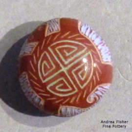 Sgraffito and painted turtle and geometric design on a miniature red seed pot