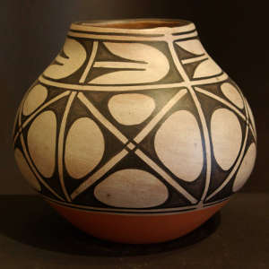 Black and white geometric design on a polychrome jar