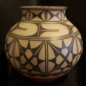 Black and white geometric design on a polychrome jar