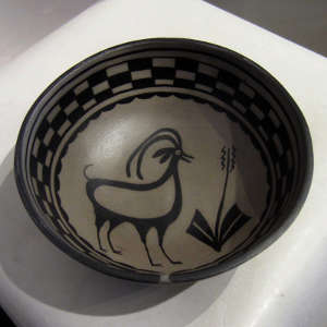 Traditional designs on a black and white bowl