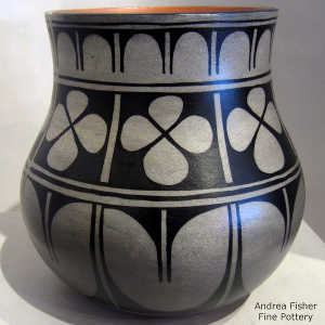 Black and white geometric design on a polychrome jar
