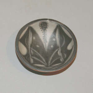 Geometric design inside a small polychrome bowl