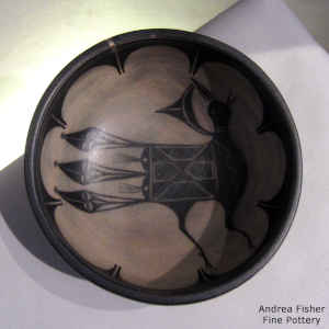 Bird and geometric design inside, geometric design outside on a polychrome chile bowl