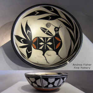 Bird and flower design inside and geometric design outside on this polychrome bowl
