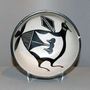 Bird and geometric design inside a polychrome bowl