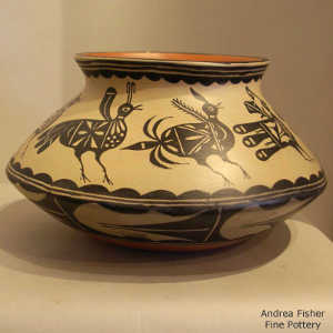 Bird and geometric design outside and large bird design inside a polychrome jar